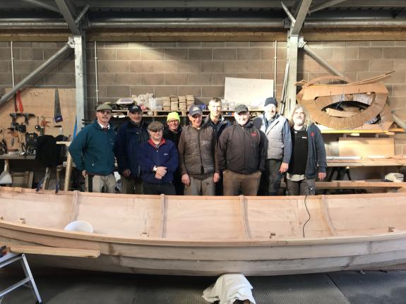 The group of volunteers who built the skiff Lady Bay